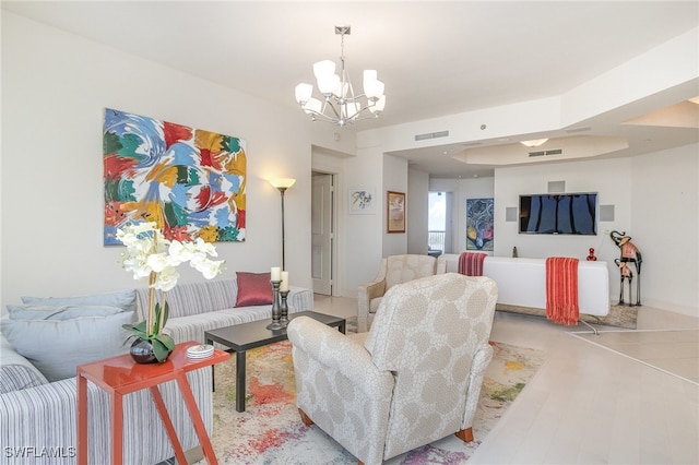 living room with an inviting chandelier