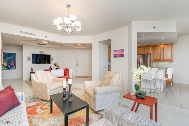 living room with light tile patterned floors and a notable chandelier