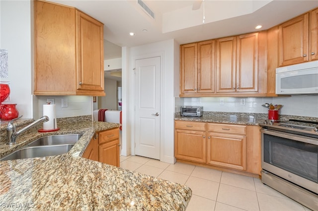 kitchen with tasteful backsplash, light stone counters, stainless steel electric stove, and sink