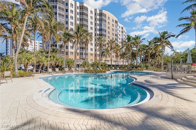 view of swimming pool with a patio