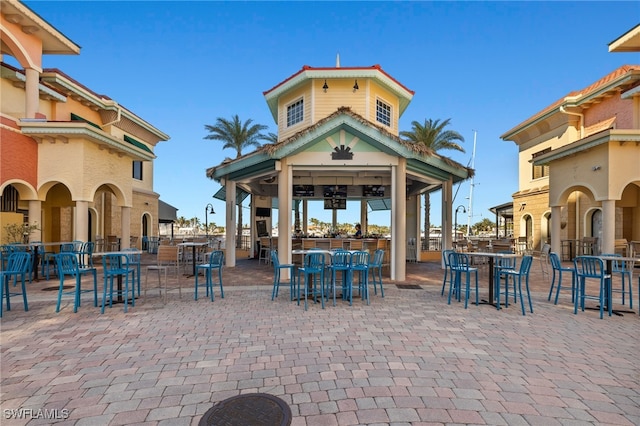 surrounding community featuring a gazebo and a bar