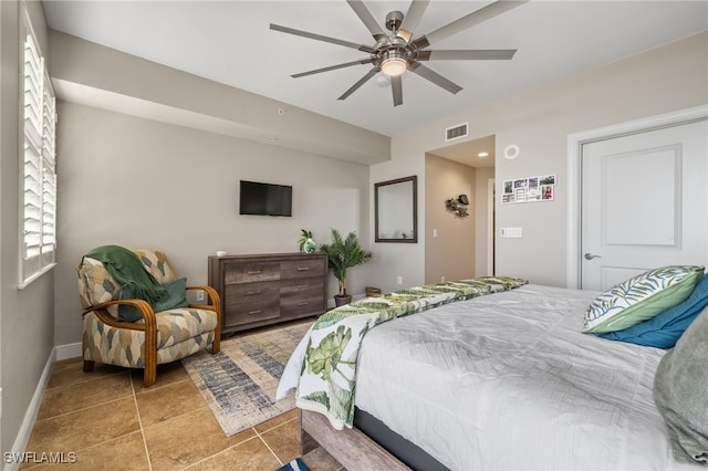 bedroom with tile patterned flooring and ceiling fan