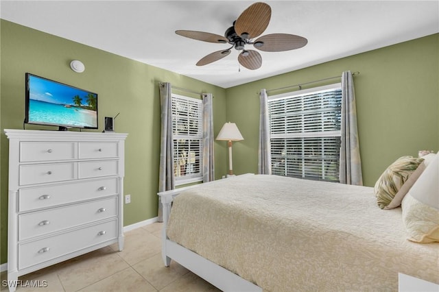 tiled bedroom with ceiling fan