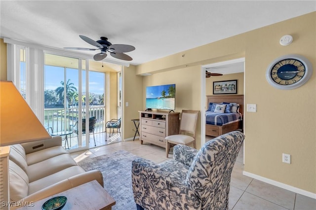 living room featuring ceiling fan and light tile patterned flooring