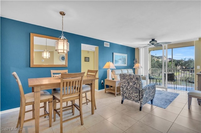 dining area featuring light tile patterned floors and ceiling fan