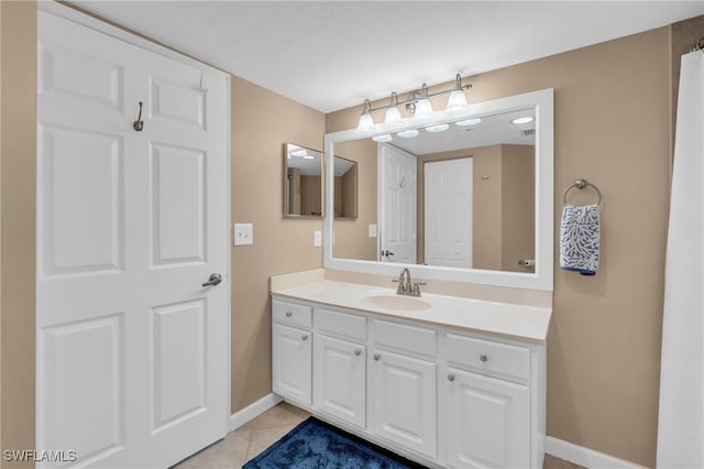 bathroom with tile patterned floors and vanity