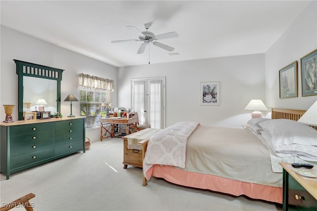 bedroom featuring ceiling fan and light carpet