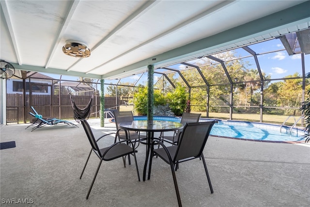 view of patio / terrace featuring a lanai