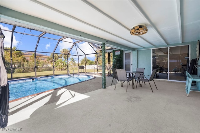 view of swimming pool with a lanai and a patio area