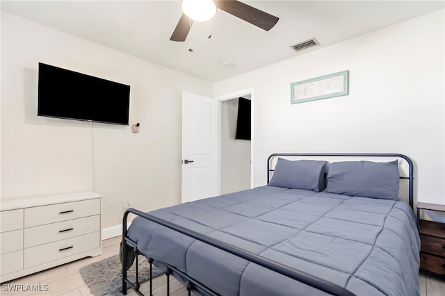 bedroom featuring ceiling fan and light hardwood / wood-style floors