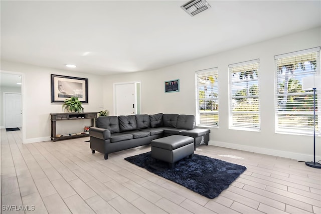 living room with light hardwood / wood-style flooring