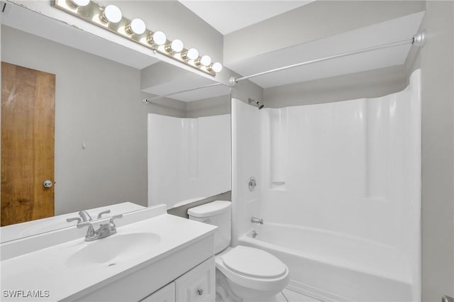 full bathroom with tile patterned floors, vanity, toilet, and washtub / shower combination