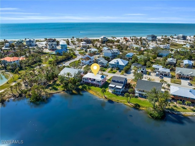 bird's eye view with a water view and a residential view