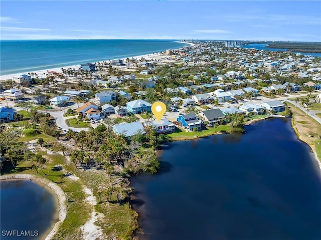 drone / aerial view with a water view and a residential view