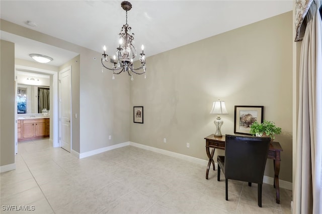 office area with light tile patterned flooring and an inviting chandelier