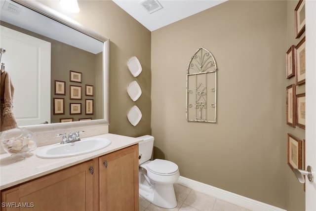 bathroom with tile patterned floors, vanity, and toilet