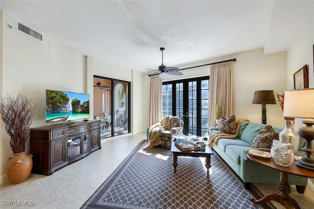 living room with ceiling fan, french doors, and light tile patterned flooring