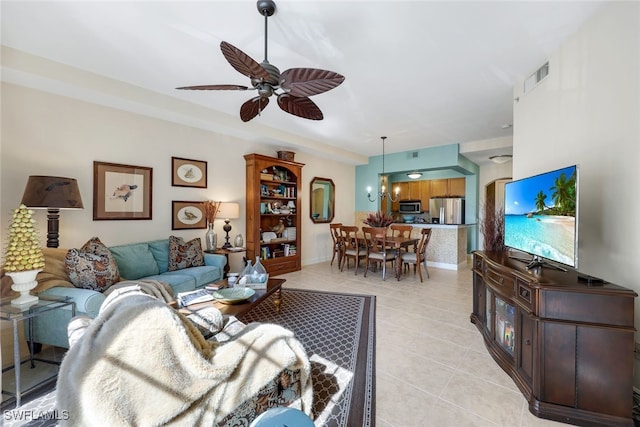 tiled living room with ceiling fan