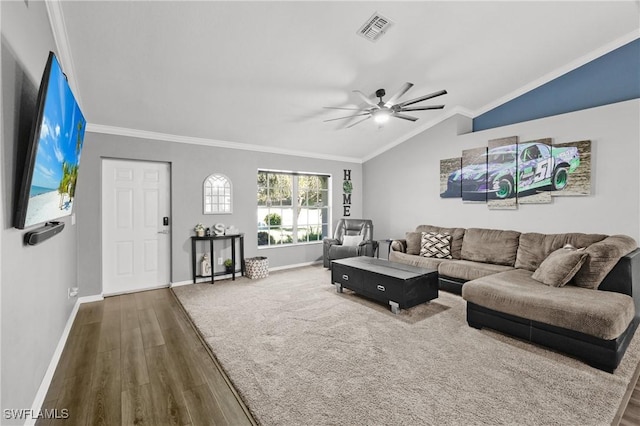 living room with ceiling fan, ornamental molding, lofted ceiling, and hardwood / wood-style flooring