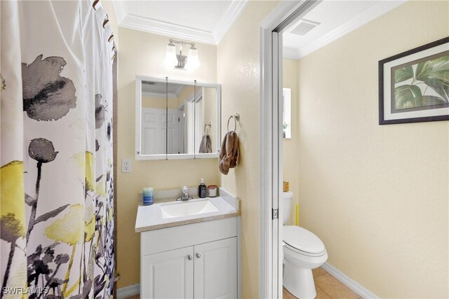 bathroom with toilet, tile patterned flooring, vanity, and ornamental molding