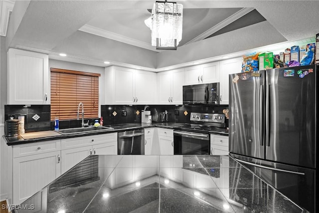 kitchen featuring backsplash, white cabinetry, crown molding, and appliances with stainless steel finishes