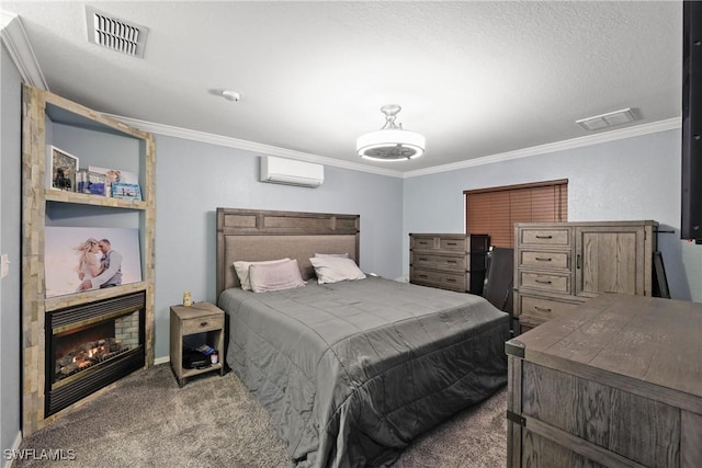 carpeted bedroom featuring a wall mounted AC, a textured ceiling, and ornamental molding