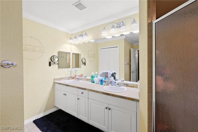 bathroom with tile patterned flooring, vanity, ornamental molding, and walk in shower