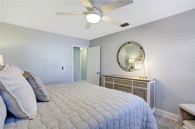 bedroom featuring ceiling fan and light hardwood / wood-style floors