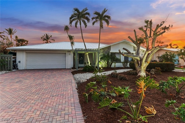 single story home featuring a garage