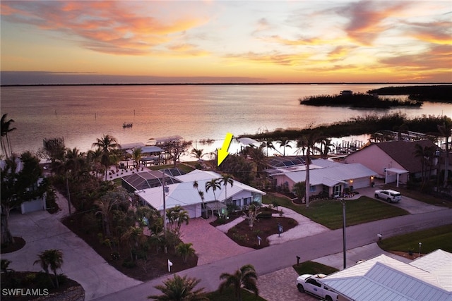 aerial view at dusk with a water view