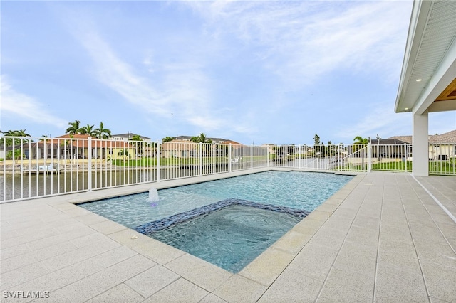 view of swimming pool with a patio area and an in ground hot tub