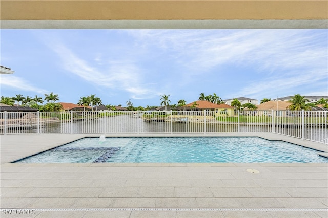 view of pool with a water view