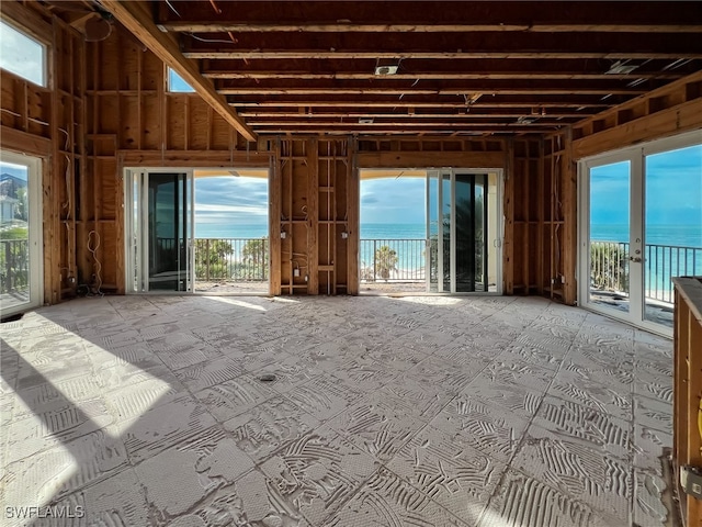 miscellaneous room with plenty of natural light and a water view