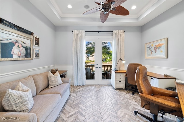 office featuring a raised ceiling, crown molding, french doors, and ceiling fan