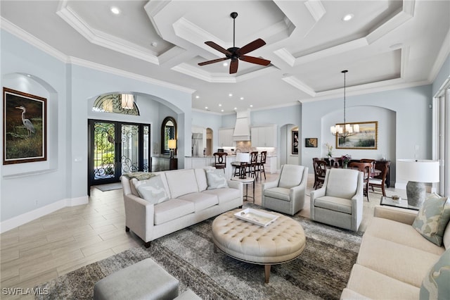 living room featuring french doors, coffered ceiling, beamed ceiling, crown molding, and ceiling fan with notable chandelier