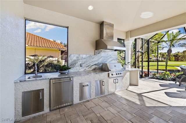 view of patio featuring area for grilling and sink