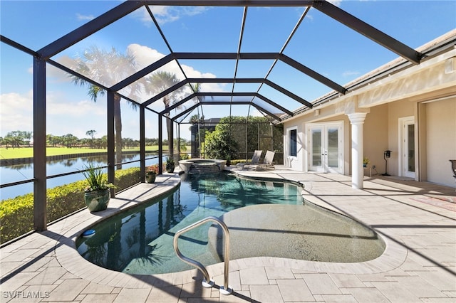 view of swimming pool with glass enclosure, french doors, an in ground hot tub, a water view, and a patio