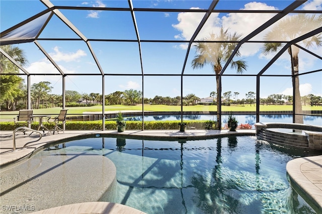 view of swimming pool featuring an in ground hot tub, a water view, glass enclosure, and a patio area