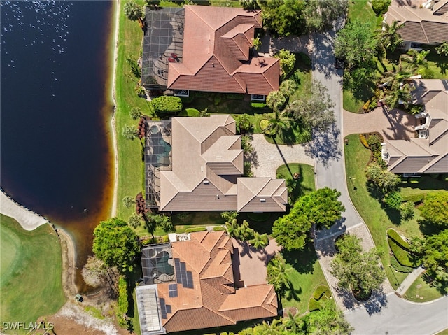 birds eye view of property with a water view