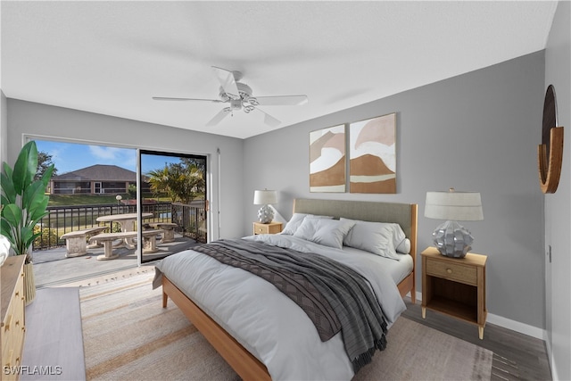 bedroom with access to exterior, ceiling fan, and hardwood / wood-style floors