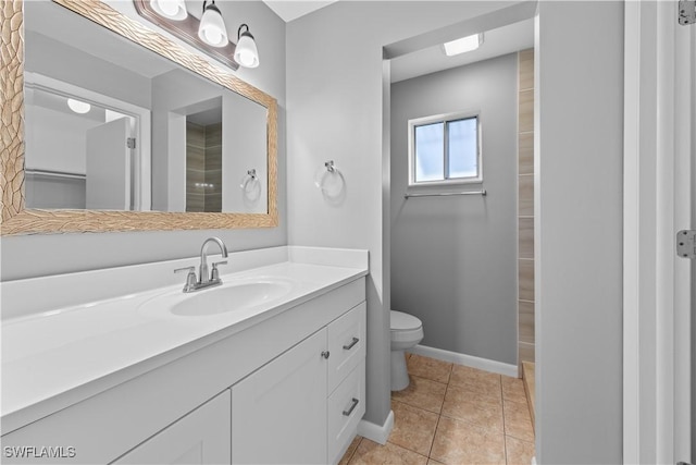 bathroom with tile patterned floors, vanity, and toilet