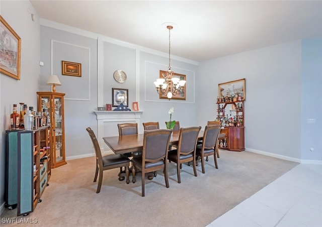 dining room with light carpet and a chandelier