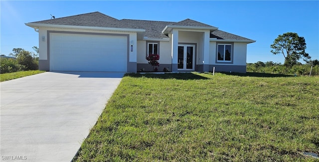 view of front of home featuring a garage, a front yard, and french doors