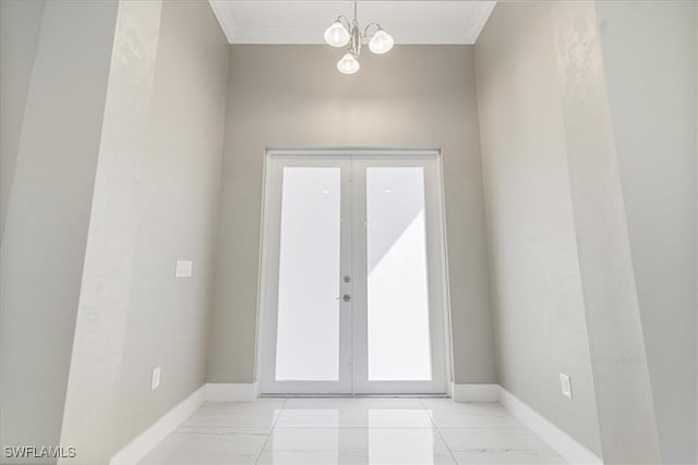 doorway featuring marble finish floor, baseboards, and french doors