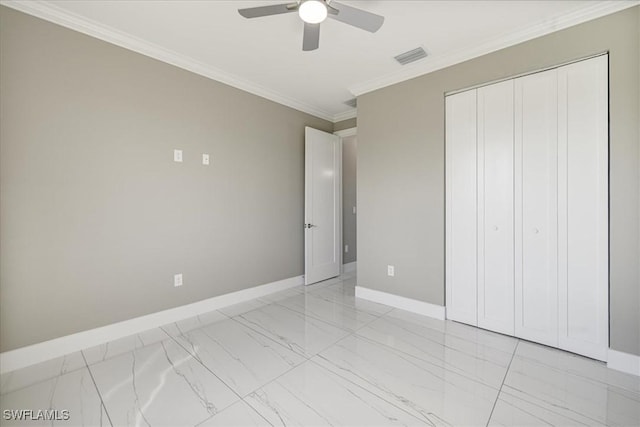 unfurnished bedroom with visible vents, baseboards, marble finish floor, a closet, and crown molding