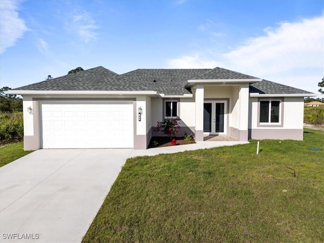 view of front facade with an attached garage, stucco siding, a front lawn, and french doors