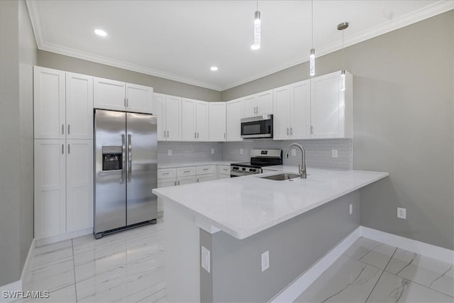 kitchen with marble finish floor, stainless steel appliances, light countertops, hanging light fixtures, and white cabinets