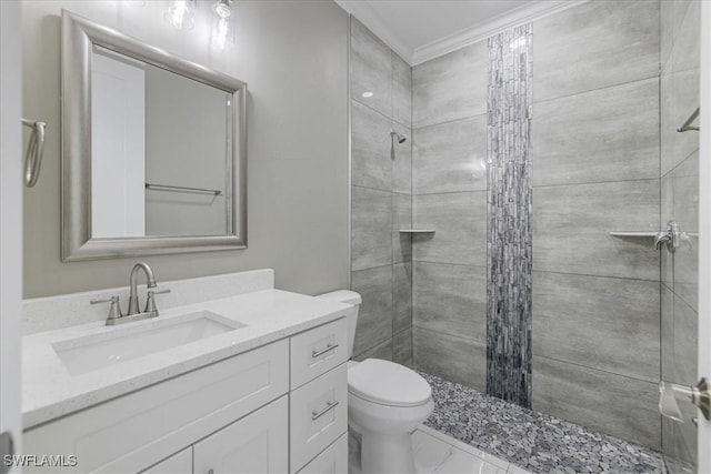 full bathroom with a stall shower, toilet, marble finish floor, crown molding, and vanity