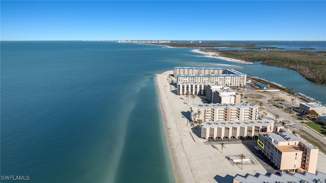 bird's eye view featuring a water view and a view of the beach