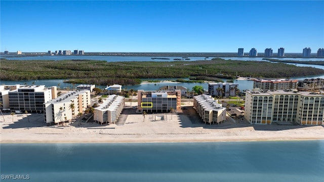 bird's eye view with a water view and a view of the beach